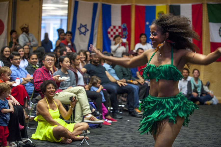 Casa Samba dancer performing for students in auditorium 